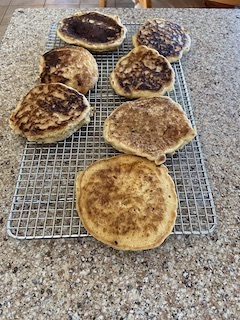 sourdough pancakes from scratch cooling on a rack