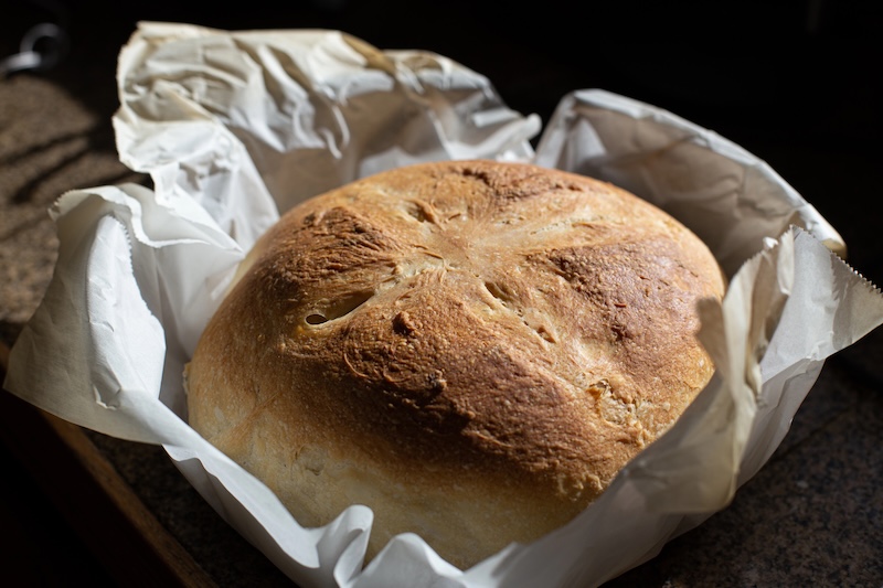 Fresh sourdough bread baked in parchment paper